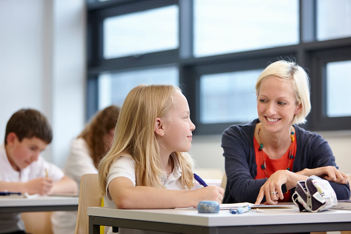 Teacher and school child