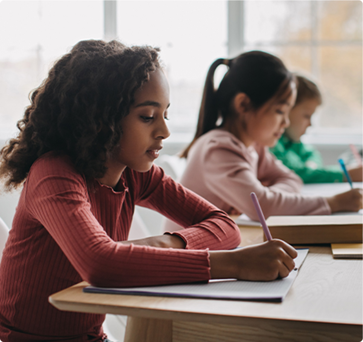 Students in classroom writing