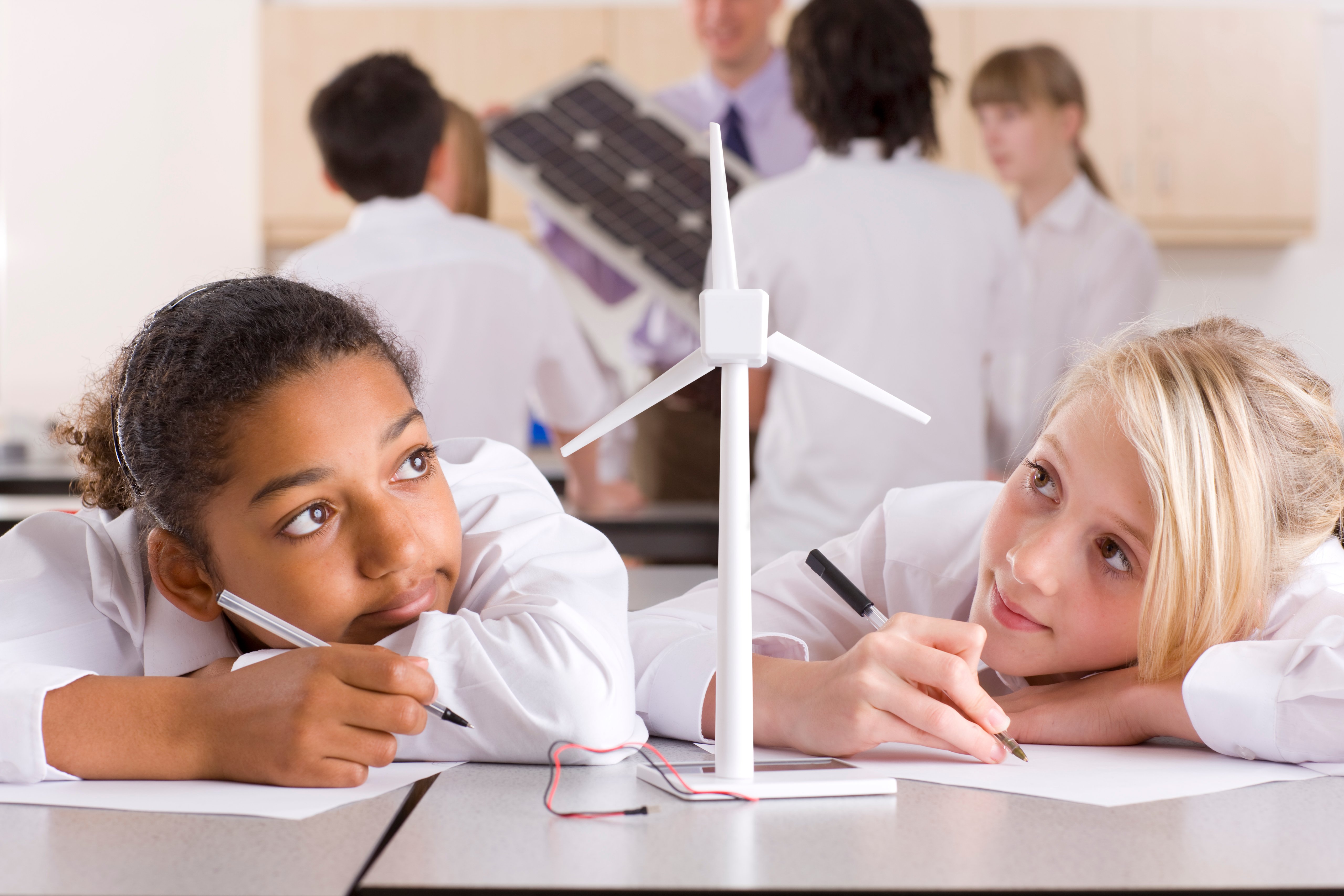 school-girls-writing-a-report-on-wind-turbines-in-2026-03-26-05-03-37-utc