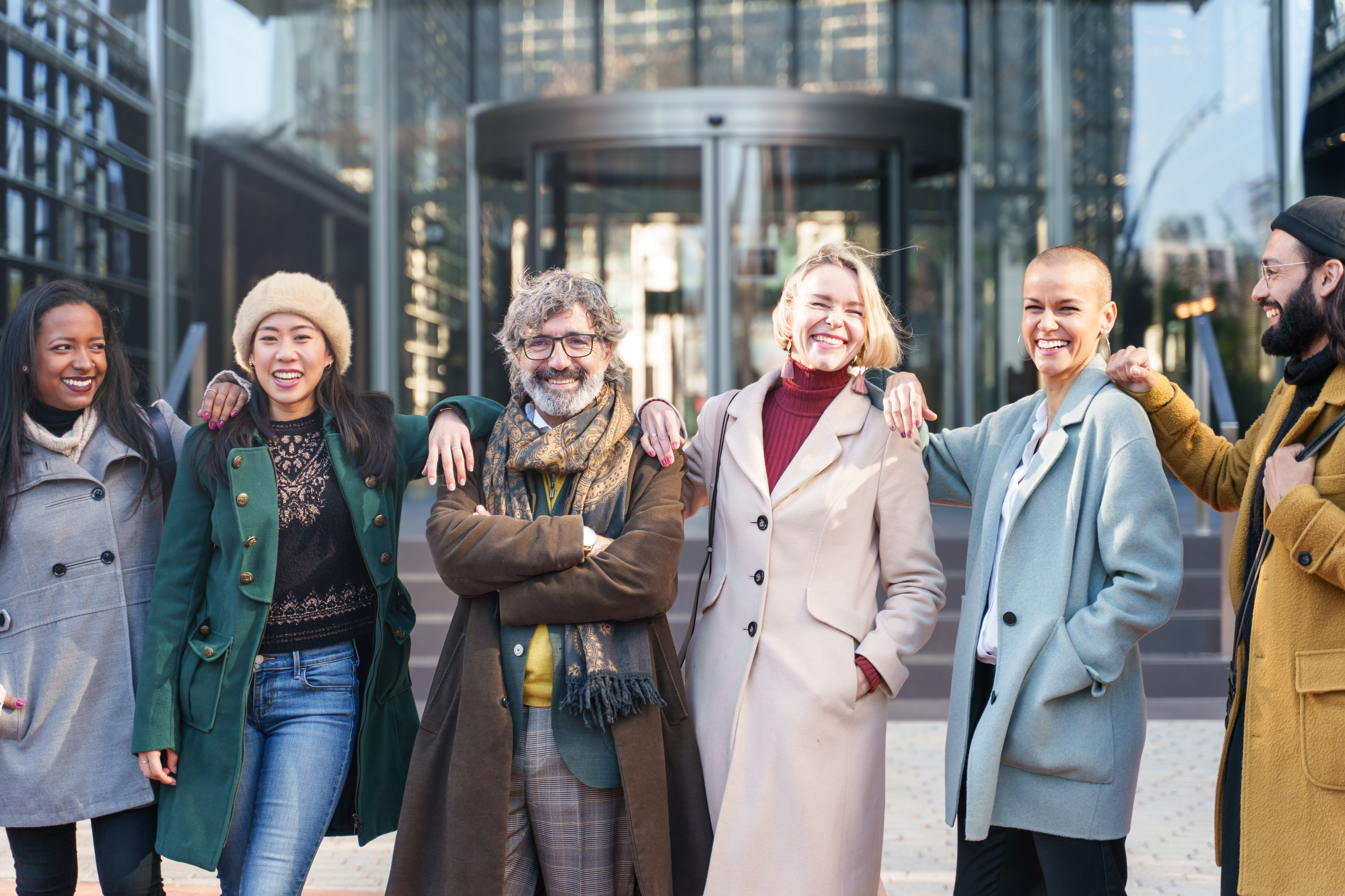 smiling-friends-wearing-stylish-coats-in-the-city-2026-03-17-20-11-48-utc