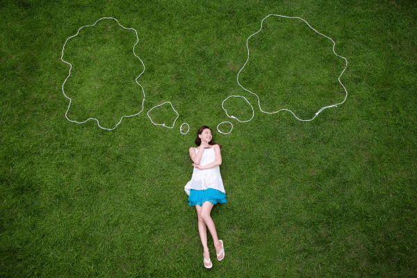 symbolic-thinking-girl-thinking-on-grass-600px-compressed